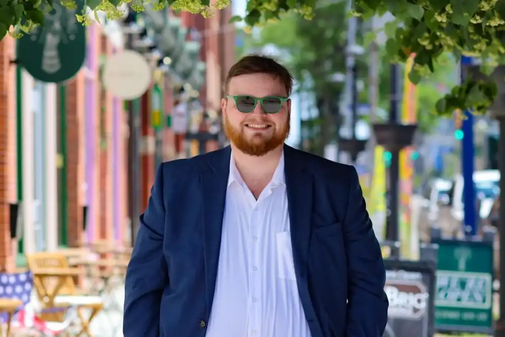 a photo Jacob Jones standing in downtown Erie