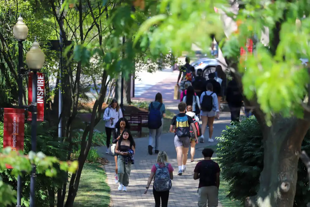 Students walking through AJ's way in September 2024