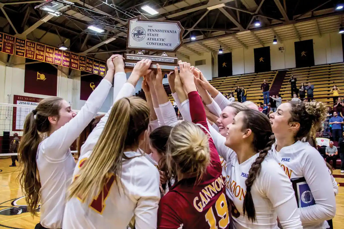 Women Volleyball celebrates as PSAC champions.