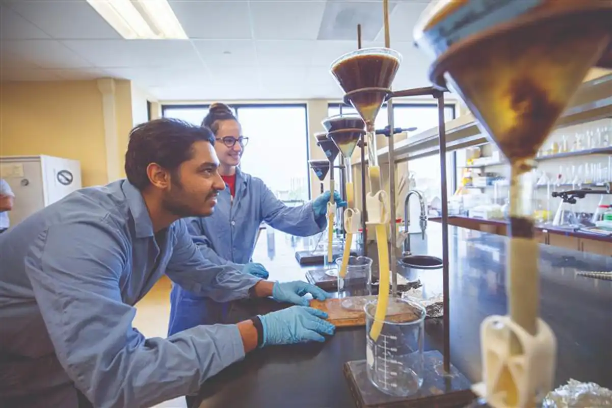 Students working in an environmental engineering lab in Pennsylvania on water filtration as part of an undergraduate environmental engineering degree program.