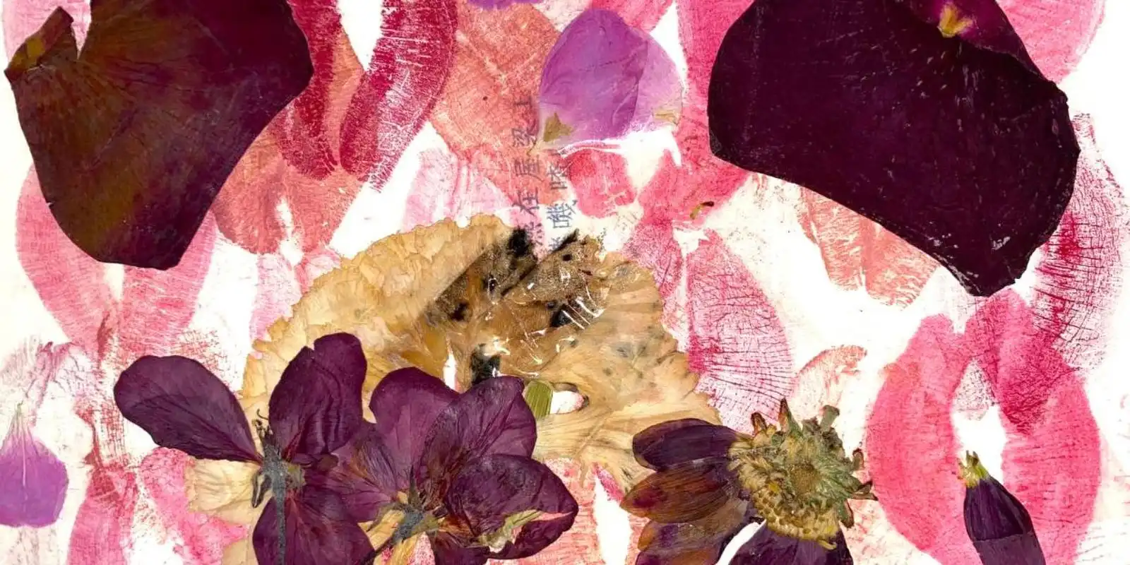 Mixed media collage of pressed flowers and lipstick prints, representing creative expression and visual art featured in 91���� University’s Totem literary magazine