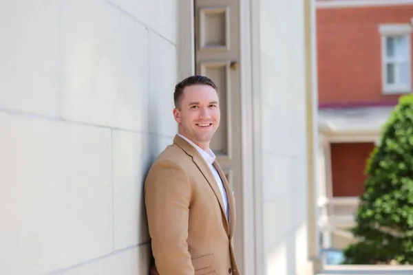 Seth, leaning against a wall