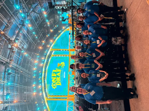 Students work security at the NFL Draft in April 2026