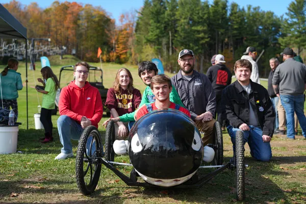 A photo of the ֱ MakerSpace team with their Peek'n Peak soapbox derby car