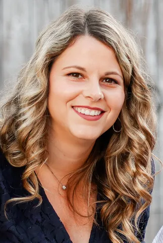 Meghan Finton smiles at the camera in a headshot