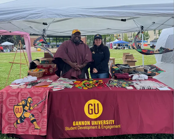 Two Gannon University employees working a Juneteenth event in Erie, Pa.