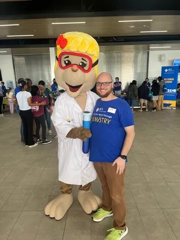 Keith Kris with the American Chemical Society mascot, Millie the Mole.