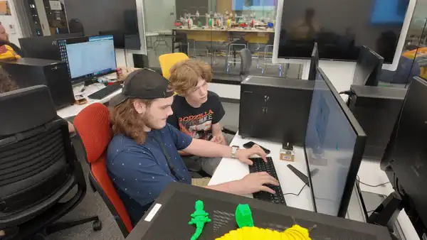 <img src="/media/gannon-university/content-assets/images/events/camps/CyberPatriot-Advance-Camp-2025.JPG" alt="Two students working together around one computer in the IHACK building" >