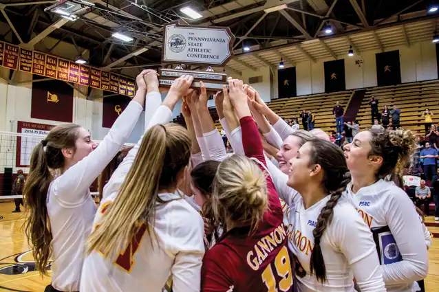 Women Volleyball celebrates as PSAC champions.