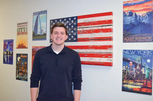Education student in front of posters.