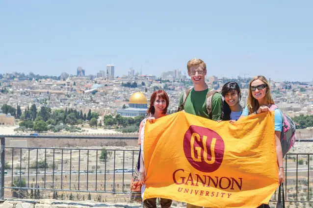 Students holding a ˶ƽ flag.