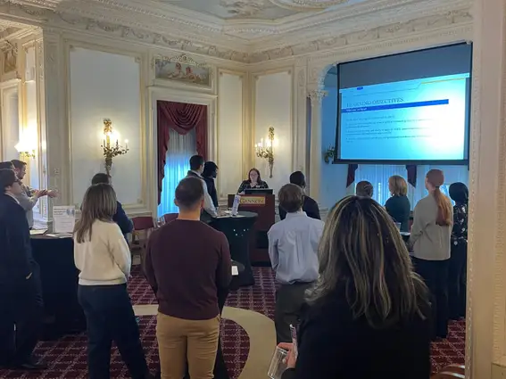 Students looking at a presentation in the board room of old main