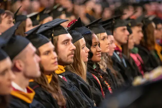 Students sitting at Commencement ceremony.