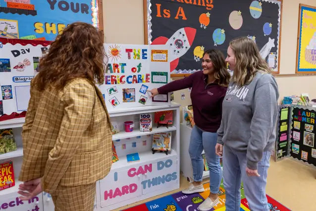 Students in the school of education giving presentations