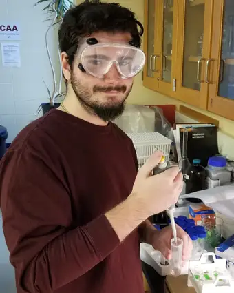 Student using a chemistry pipette