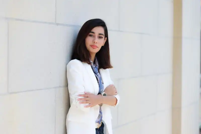 Haieda Sharifi leaning against a wall