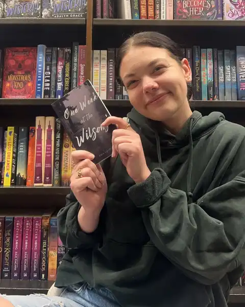 Kara Lynch poses with her book 