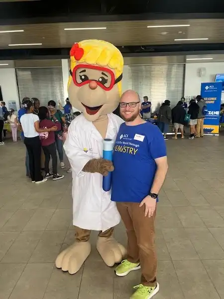 Keith Kris with the American Chemical Society mascot, Millie the Mole.