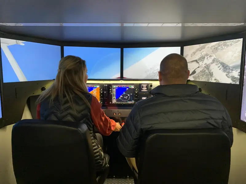 Aviation and Business Management student participates in a virtual flight simulator