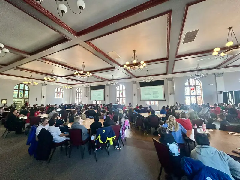 Students and group advisors watch the awards presentations for ������Ƶ's 2026 MATHCOUNTS competition