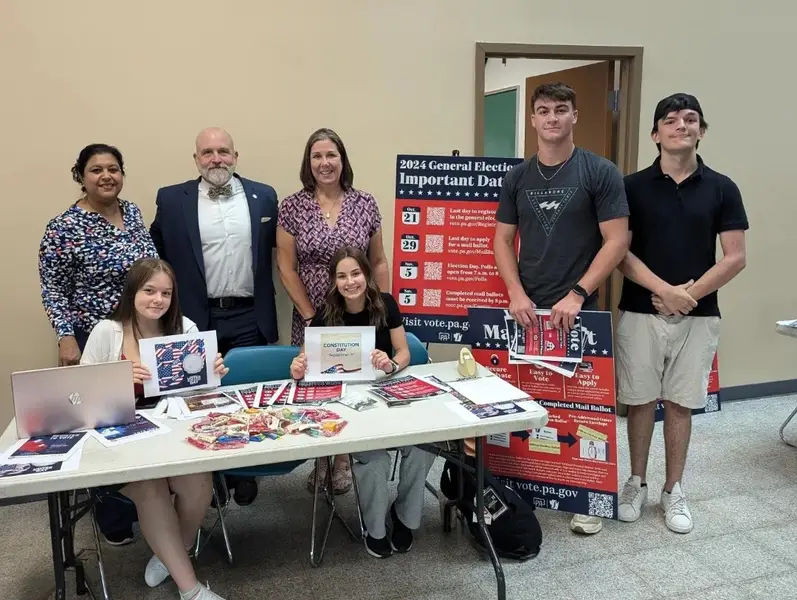 Students and faculty at voter registration table