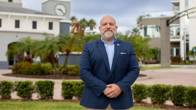 Walter Iwanenko standing in front of Gannon's Ruskin campus