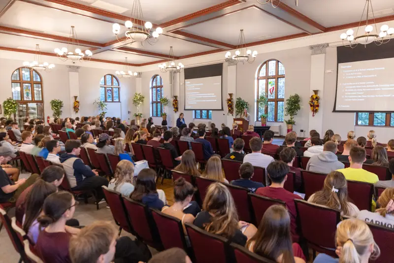 A crowd watches Dr. Annika Marie Schoene speak at Gannon University's fall Orlando Lecture in the Yehl Ballroom