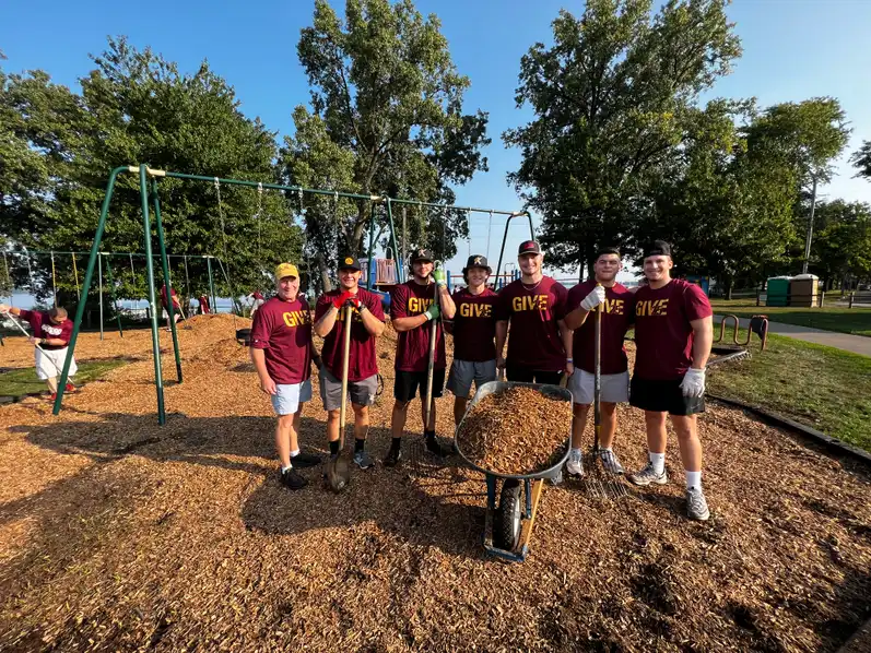 Students volunteering at a park on GIVE day.